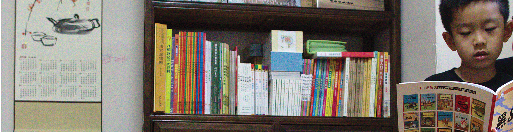 Lingyi Chen reads to her son, Xiaoxiao, at her mother's home in Shanghai, China.