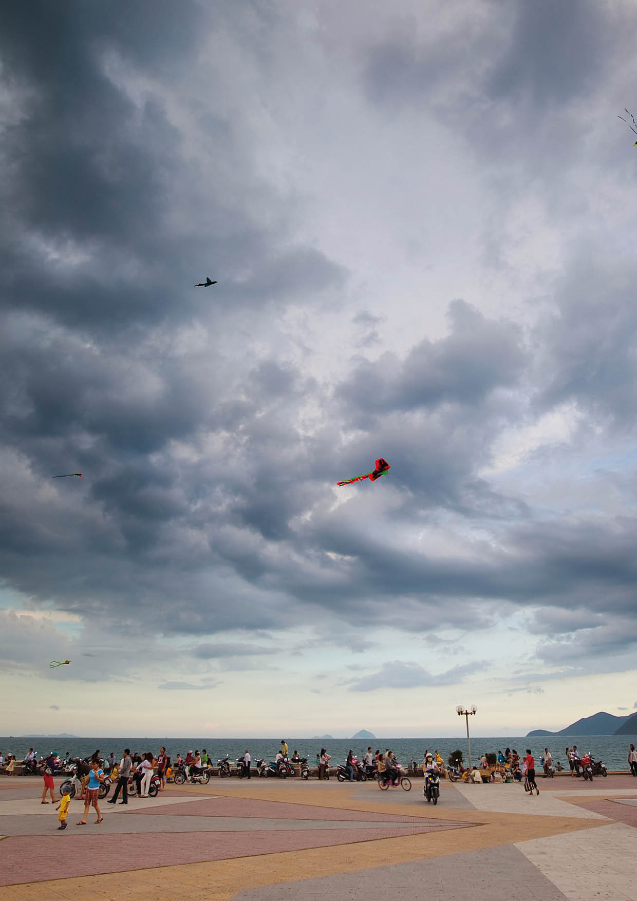 Kite flying on the walkway alongside Nha Trang Beach in Vietnam 