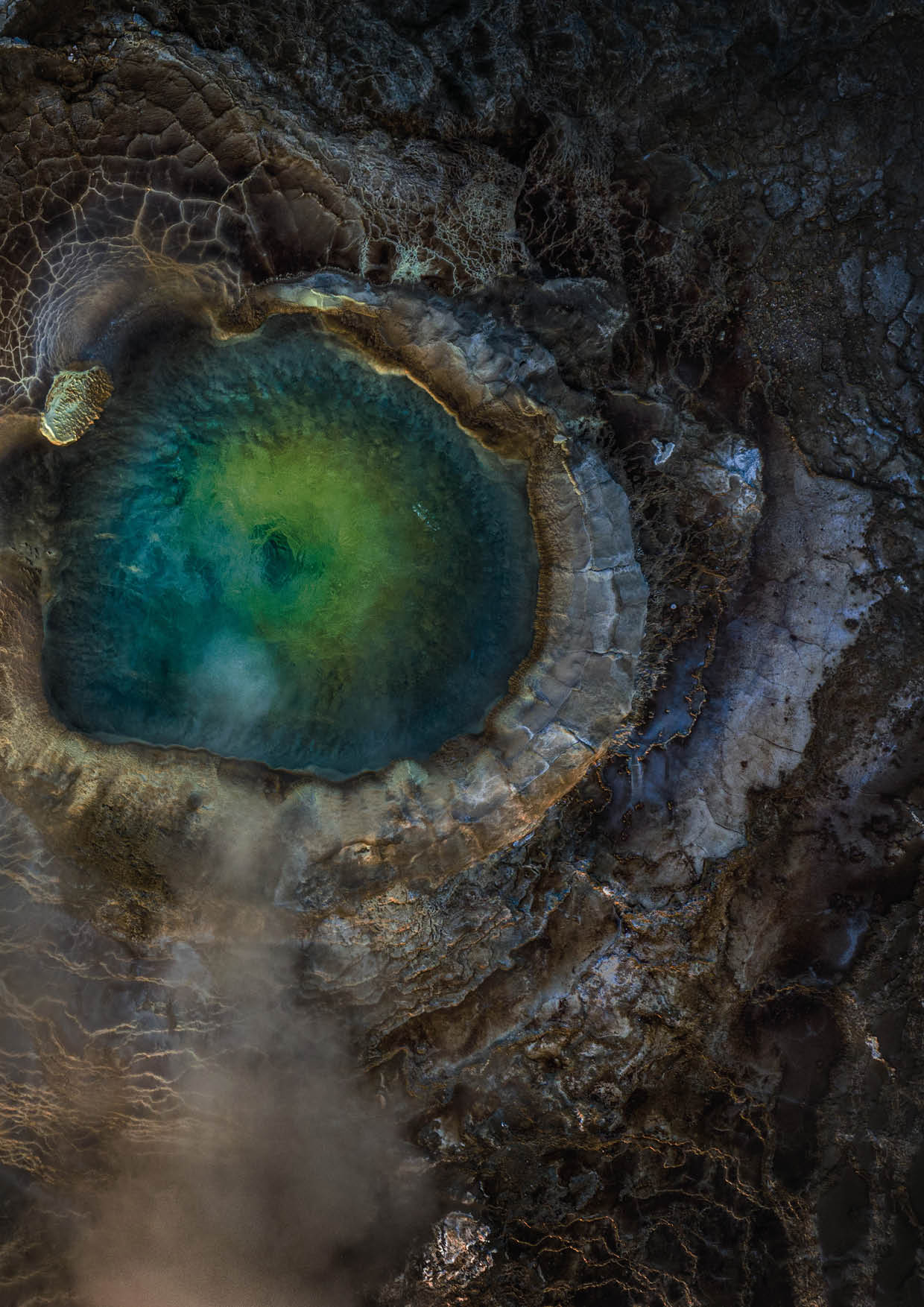 Iceland. The top-down view of an emerald geothermal pool in the Icelandic Highlands.