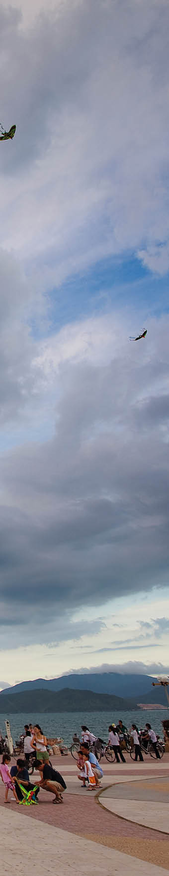 Kite flying on the walkway alongside Nha Trang Beach in Vietnam.