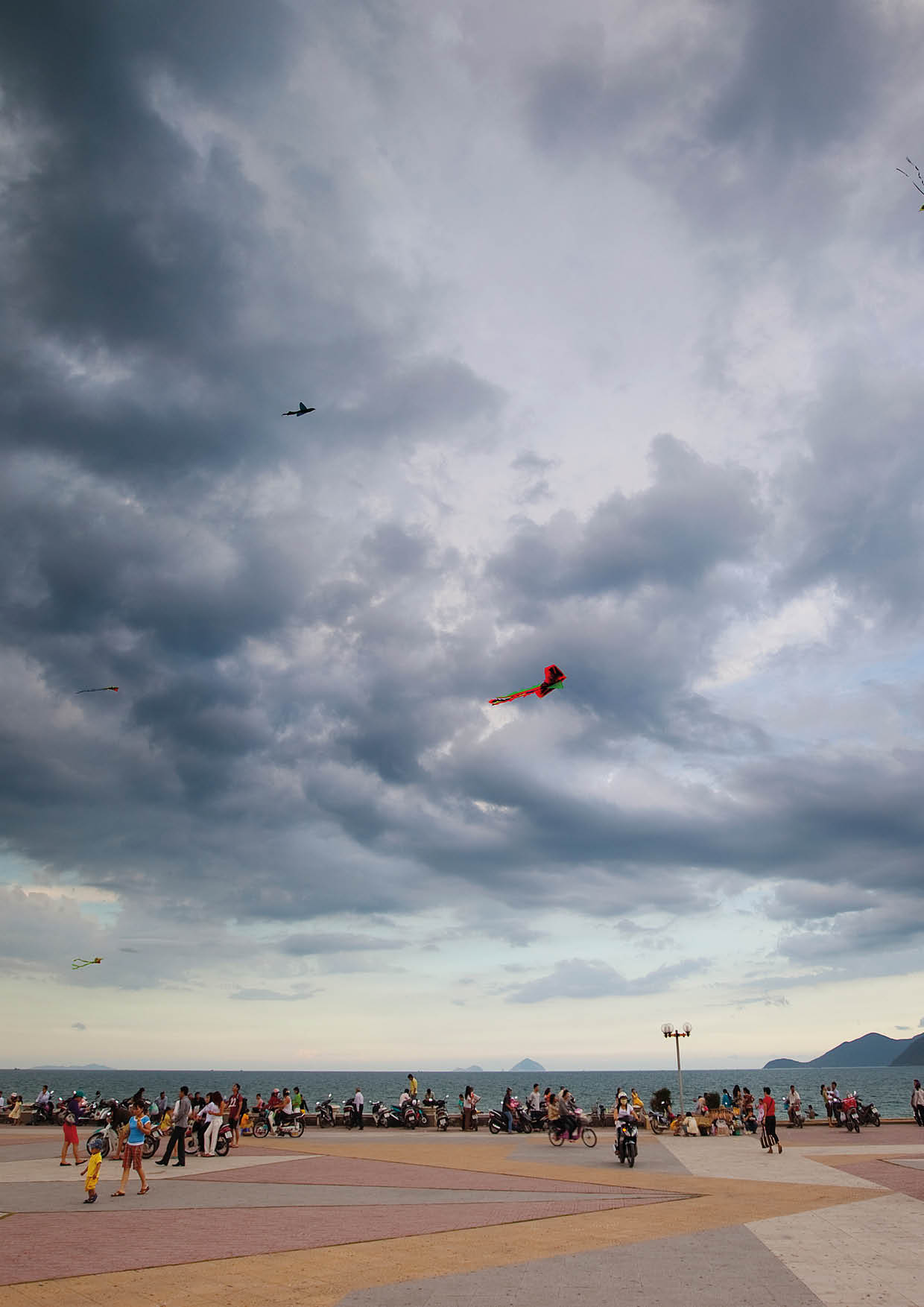 Kite flying on the walkway alongside Nha Trang Beach in Vietnam.
