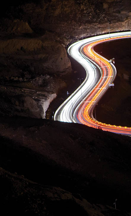 Light trails on road at night, Saudi Arabia.  (Photo Credit: Mohammed Al Ali/ 500px/National Geographic Creative)