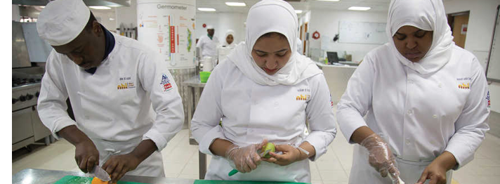 Trainees at the Hospitality Training Center learn food prep techniques from Chefs in Muscat, Oman. Not Model Released Permissions gathered by NGL employees -------------------  Men receive a haircut and beard trim at a men's salon in Muscat, Oman.  A group of women enjoy an ice-cream and some conversation at an ice-cream shop in Muscat, Oman.  Not Model Released Permissions gathered by NGL employees -------------------  A family enjoys a picnic along the beach in Muscat, Oman.  Not Model Released Permissions gathered by NGL employees -------------------