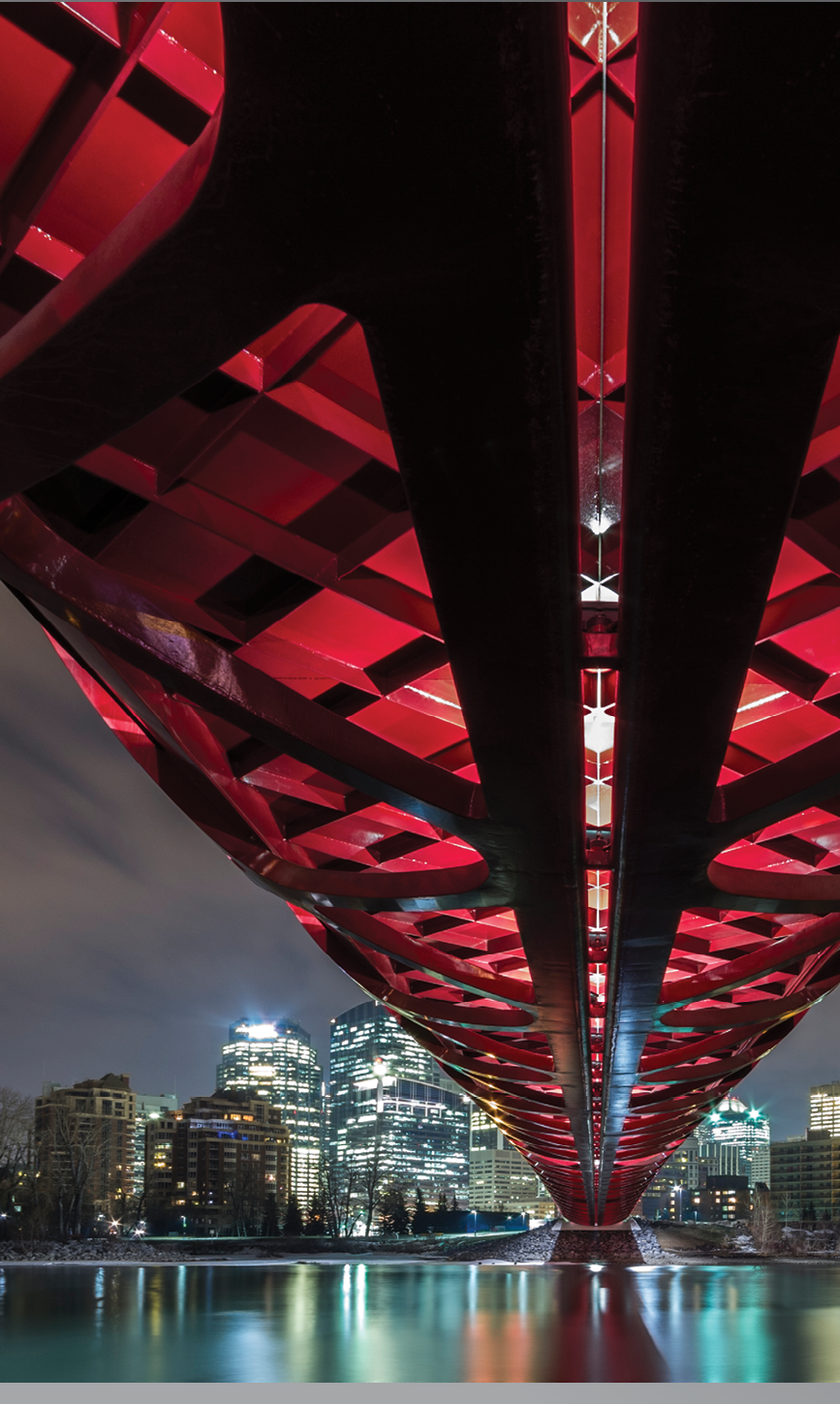 Pedestrian Peace Bridge and Downtown Calgary reflecting in the Bow River at night. Calgary, Alberta, Canada.  from Offset. ID: 486758 Claude Robidoux / All Canada https://www.offset.com/photos/pedestrian-peace-bridge-and-downtown-calgary-reflecting-in-the-bow-486758