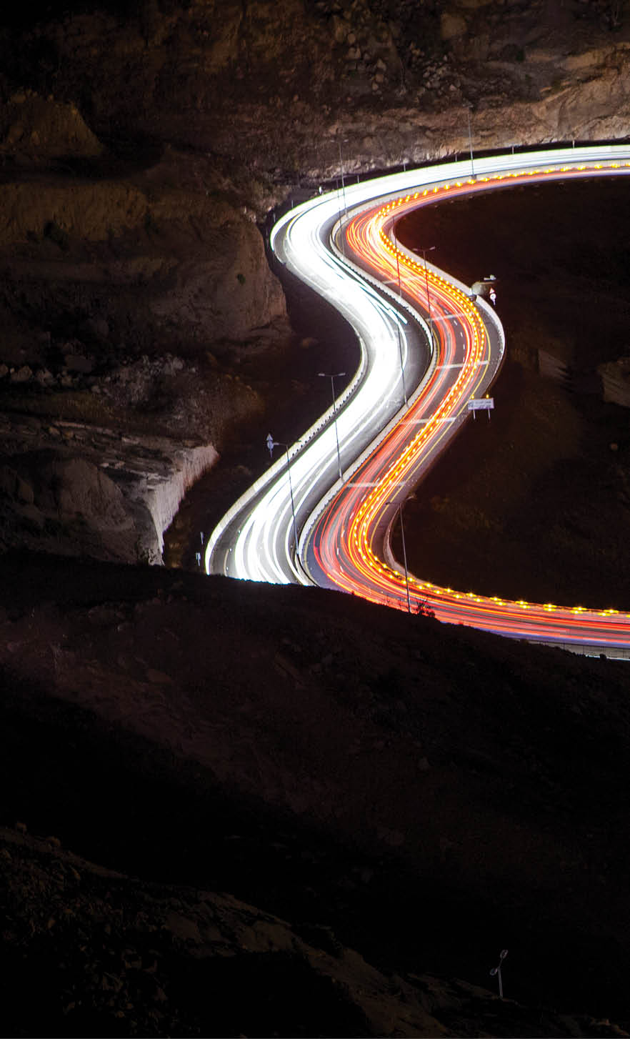 Light trails on road at night, Saudi Arabia.  (Photo Credit: Mohammed Al Ali/ 500px/National Geographic Creative)