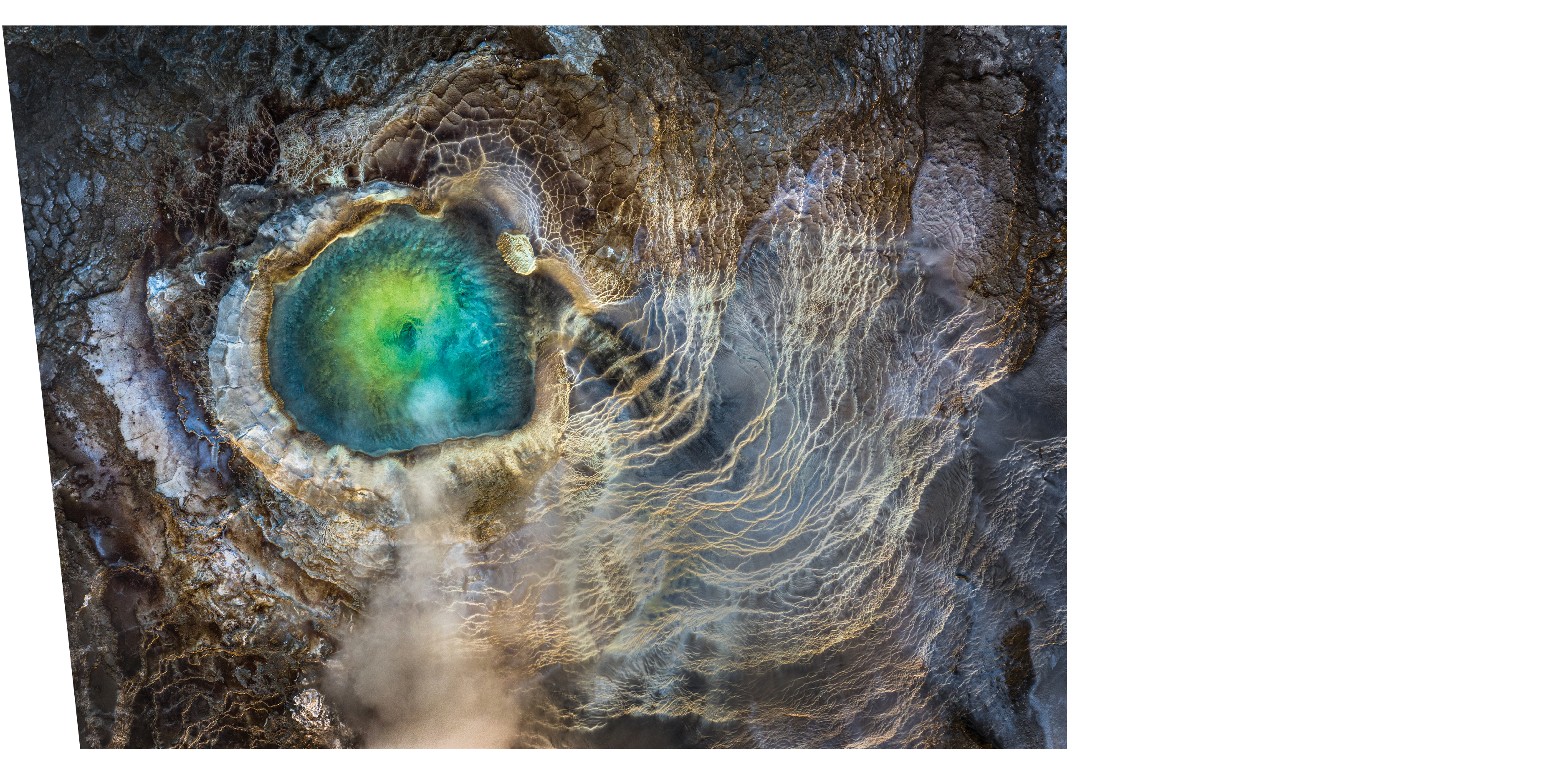 Iceland. The top-down view of an emerald geothermal pool in the Icelandic Highlands.