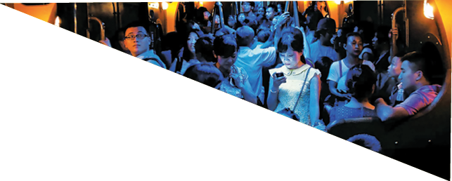 On a hot day in Hong Kong, people crowded into an air-conditioned train. When the lights dimmed, one young woman stood out, lost in the glow of her own digital world.