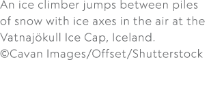An ice climber jumps between piles of snow with ice axes in the air at the Vatnaj kull Ice Cap, Iceland. ©Cavan Image...