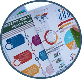 Crop shot from above of man creating new modern project with colorful charts working at desk. 