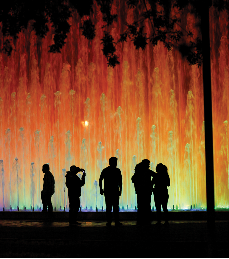 Colourful lights and fountains at the water park in central Lima, Peru, South America.