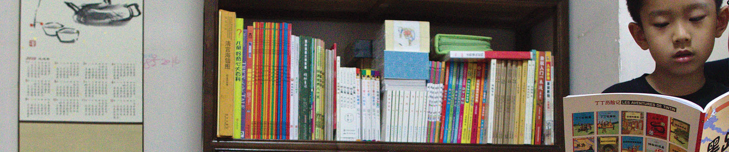 Lingyi Chen reads to her son, Xiaoxiao, at her mother's home in Shanghai, China 