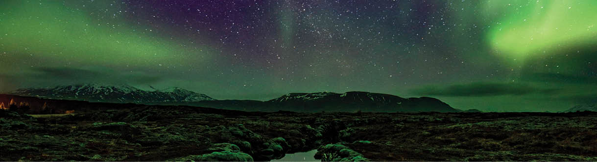 Aurora over the Silfra rift on the tectonic plates which straddle Iceland  The rift is full of gin clear water which is reflecting the aurora 
