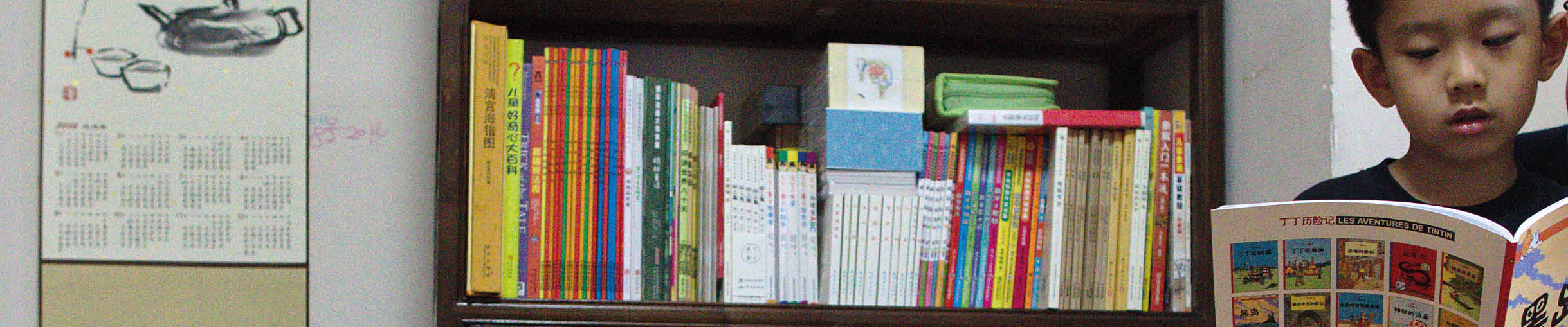 Lingyi Chen reads to her son, Xiaoxiao, at her mother's home in Shanghai, China.