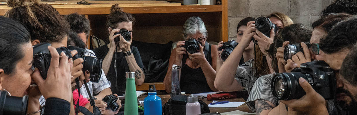 Women and men learn the basics of camera functions during a class on photography at SESC in Sao Paulo, Brazil. (Releases in SP Photo Class, SP Folder 8 but not everyone appears to be in this folder….but we cannot really see faces so maybe ok. Get with Vanessa if needed)