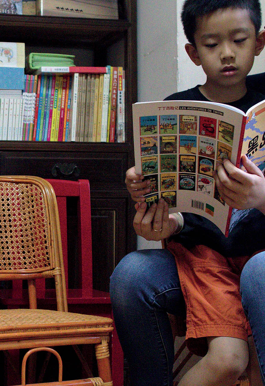 Lingyi Chen reads to her son, Xiaoxiao, at her mother's home in Shanghai, China.