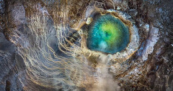 Iceland. The top-down view of an emerald geothermal pool in the Icelandic Highlands.