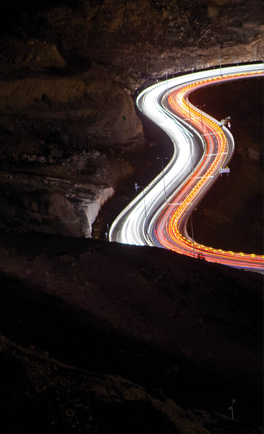 Light trails on road at night, Saudi Arabia.  (Photo Credit: Mohammed Al Ali/ 500px/National Geographic Creative)