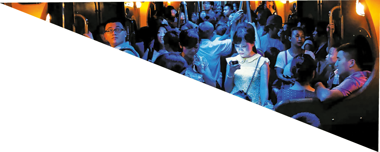 On a hot day in Hong Kong, people crowded into an air-conditioned train. When the lights dimmed, one young woman stood out, lost in the glow of her own digital world.