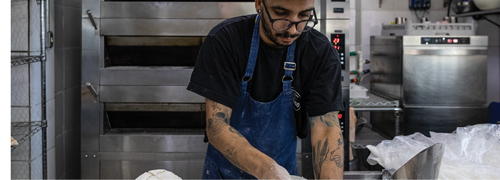Pastry chef, Tiago Oliveira Saraiva, prepares bread in his kitchen at the Santiago Padaria Artesanal in Sao Paulo, Brazil. Artisanal bread and shops like these are very popular in Brazil (Release in SP Bakery, SP Folder 2)